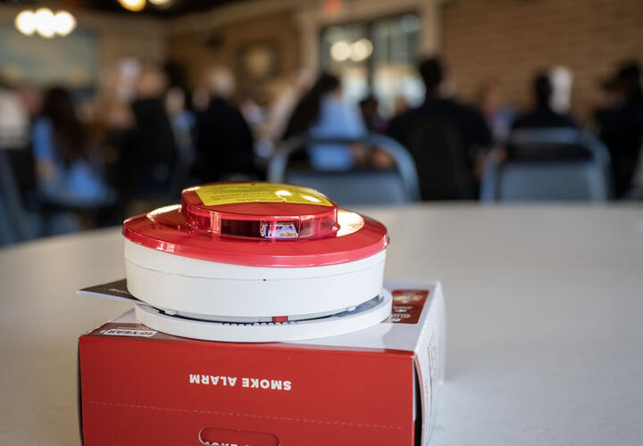 A fire alarm, unboxed, static on a white table