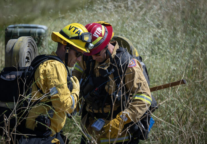 Two regional firefighters participate in drill.