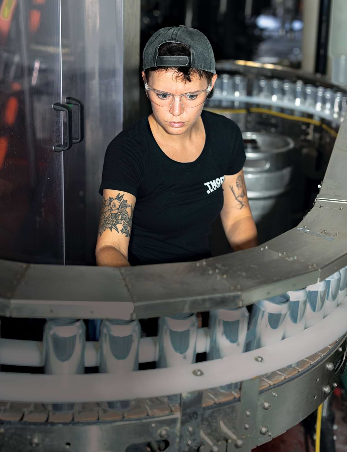 Thorn Brewing Worker inspecting brewing equipment