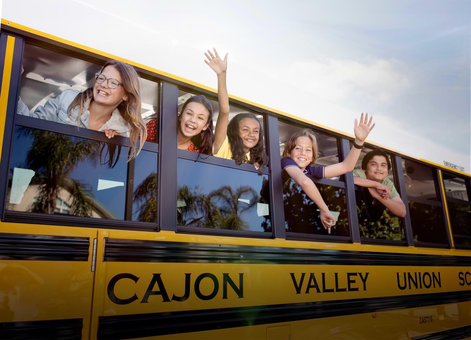 Cajon Valley Schools Electric Bus with Happy Students