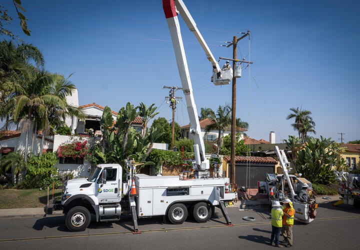 SDG&E utility workers performing work in a San Diego neighborhood.