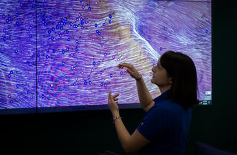 SDG&E Meterologist tracking severe weather on a large screen