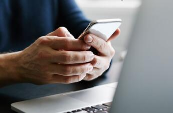 someone holding their mobile phone.