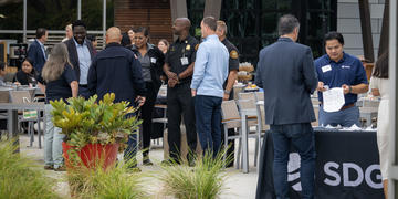 Image of individuals registering for an SDG&E community partners event. 